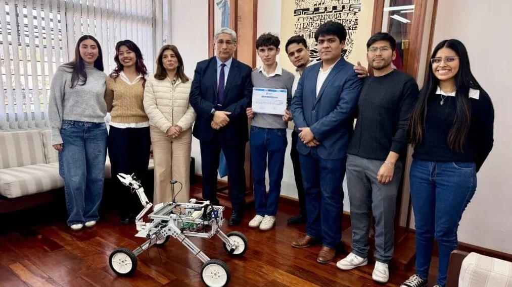 ROVIK-1 team with the rover during an institutional recognition event